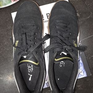 Puma Black Sneakers with White and Gold Accents And Tan Sole.